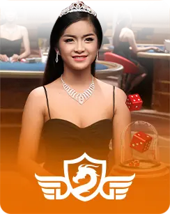Female live dealer wearing a tiara and elegant black dress representing DreamGaming Casino, with a gaming table in the background.